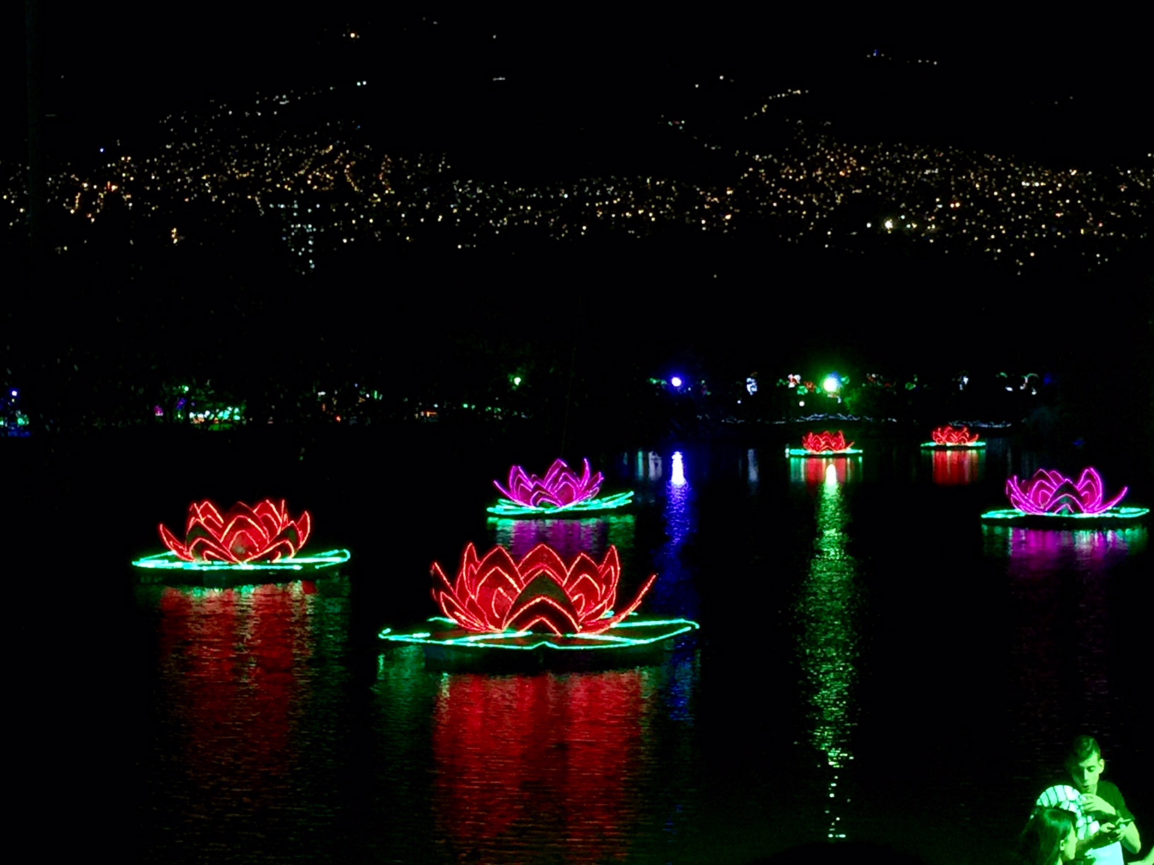 Floating lights with Medellin lights in the background